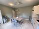 Staff break room equipped with modern table, kitchenette and white appliances at 1345 2Nd St, Sarasota, FL 34236