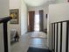 Bright hallway with neutral tones leads to an outdoor patio, enhancing the home's open feel at 1345 2Nd St, Sarasota, FL 34236