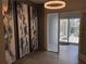 Inviting hallway with decorative art leading to a bright balcony space with outdoor seating at 1345 2Nd St, Sarasota, FL 34236