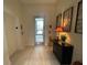 Hallway with tile floors, lift, and modern decorations at 1345 2Nd St, Sarasota, FL 34236