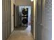 Laundry room shows a stacked washer and dryer unit nestled between grey closet doors at 1345 2Nd St, Sarasota, FL 34236