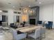 Spacious living room with a modern fireplace, dining area, and comfortable seating arrangements at 1345 2Nd St, Sarasota, FL 34236