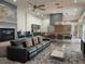 Open-concept living room featuring modern furniture, a fireplace, and seamless flow into the dining and kitchen area at 1345 2Nd St, Sarasota, FL 34236