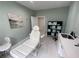 Bright treatment room featuring a chair, cabinets, sink, and soft natural lighting at 1345 2Nd St, Sarasota, FL 34236
