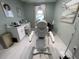 This is a nice treatment room featuring modern decor and a massage table at 1345 2Nd St, Sarasota, FL 34236
