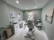 Bright treatment room featuring a chair, cabinets, sink, and soft natural lighting at 1345 2Nd St, Sarasota, FL 34236