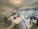 Bright room featuring equipment, treatment bed, cabinets, and soft natural lighting at 1345 2Nd St, Sarasota, FL 34236
