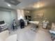 Bright room featuring equipment, treatment bed, cabinets, and soft natural lighting at 1345 2Nd St, Sarasota, FL 34236