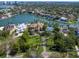 Stunning waterfront estate featuring lush landscaping, a private dock, and a sport court at 1423 & 1435 Hillview Dr, Sarasota, FL 34239