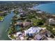 A waterfront community with luxurious homes, lush greenery, and stunning water views at 1423 & 1435 Hillview Dr, Sarasota, FL 34239
