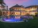 Expansive backyard featuring a modern pool, hot tub, and covered patio with a spiral staircase, perfect for entertaining at 1423 & 1435 Hillview Dr, Sarasota, FL 34239