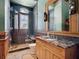 Unique bathroom with stone shower and pebble accents at 1423 & 1435 Hillview Dr, Sarasota, FL 34239