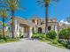 Impressive home featuring a covered entrance, stone facade, and meticulously maintained landscaping at 1423 & 1435 Hillview Dr, Sarasota, FL 34239