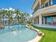 Luxury home backyard featuring pool, covered patio, spiral staircase and outdoor dining at 1423 & 1435 Hillview Dr, Sarasota, FL 34239