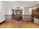 Elegant foyer with a wooden banister and a stained-glass window, creating a grand entrance at 1423 & 1435 Hillview Dr, Sarasota, FL 34239