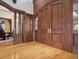 Grand foyer featuring hardwood floors, detailed trim, and a glimpse into the dining area at 1423 & 1435 Hillview Dr, Sarasota, FL 34239