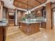 Large kitchen featuring custom wood cabinetry, a center island, and hardwood floors at 1423 & 1435 Hillview Dr, Sarasota, FL 34239