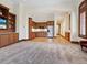 Open kitchen with wood cabinetry, stainless steel appliances, a nearby window, and hardwood floors at 1423 & 1435 Hillview Dr, Sarasota, FL 34239