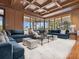 Spacious living room featuring a wraparound sofa, marble floors, and bright, airy windows at 1423 & 1435 Hillview Dr, Sarasota, FL 34239