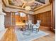 Elegant living room with decorative ceiling, and an arched doorway leading to the grand foyer at 1423 & 1435 Hillview Dr, Sarasota, FL 34239