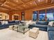 Spacious living room features custom wood paneling, coffered ceiling and luxurious furniture at 1423 & 1435 Hillview Dr, Sarasota, FL 34239