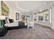 This expansive main bedroom offers a serene retreat with plush carpet, a seating area and water views at 1423 & 1435 Hillview Dr, Sarasota, FL 34239