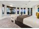 This tranquil main bedroom has plush carpet, custom décor, and abundant natural light from the surrounding water views at 1423 & 1435 Hillview Dr, Sarasota, FL 34239