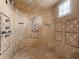 Luxurious tiled shower with multiple shower heads and a built-in seat for a spa-like experience at 1423 & 1435 Hillview Dr, Sarasota, FL 34239