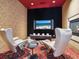 Comfortable theater room with cozy seating, fireplace, and large screen for immersive entertainment at 1423 & 1435 Hillview Dr, Sarasota, FL 34239