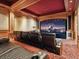 Home theater features a large screen, comfortable seating, and custom wood paneling at 1423 & 1435 Hillview Dr, Sarasota, FL 34239