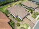 Beautiful aerial view of single Gathering homes featuring lush landscaping and brick paver driveways in a planned community at 15752 Sacile Ln, Bradenton, FL 34211