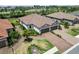 Aerial view of the property with a wide driveway, well-maintained landscaping, and an attached two-car garage at 15752 Sacile Ln, Bradenton, FL 34211