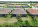 Birds-eye view of the property highlighting its location among well-manicured lawns and screened lanais at 15752 Sacile Ln, Bradenton, FL 34211