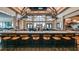 Upscale bar area with a large selection of beverages, stylish seating, and a lively atmosphere at 15752 Sacile Ln, Bradenton, FL 34211