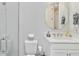 Clean bathroom featuring walk-in shower, toilet, and vanity with granite countertop at 15752 Sacile Ln, Bradenton, FL 34211