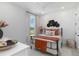 Comfortable bedroom with shiplap accent wall, metal bed frame, and bright window with a view at 15752 Sacile Ln, Bradenton, FL 34211