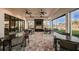Well-lit common room featuring tables, chairs, and expansive windows with outdoor views at 15752 Sacile Ln, Bradenton, FL 34211