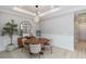 Bright dining room features modern lighting, wainscoting, and stylish decor at 15752 Sacile Ln, Bradenton, FL 34211