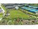 A dog park with lush landscaping, providing a safe and enjoyable space for pets and their owners at 15752 Sacile Ln, Bradenton, FL 34211