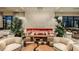 Elegant lobby area with comfortable seating, modern art, and a welcoming ambiance at 15752 Sacile Ln, Bradenton, FL 34211