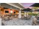 Inviting outdoor patio with comfortable seating, umbrellas, and views of the community at 15752 Sacile Ln, Bradenton, FL 34211