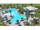 Beautiful resort-style pool with plenty of lounge chairs and umbrellas at 15752 Sacile Ln, Bradenton, FL 34211