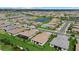 Aerial view of a residential area showcasing homes, ponds, and community layout at 16012 Sunny Day Dr, Bradenton, FL 34211