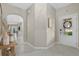 Bright entryway features tile floors, neutral walls, and an archway leading to the rest of the home at 16012 Sunny Day Dr, Bradenton, FL 34211