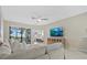 Inviting living room flows to screened patio and offers glimpses of the main bedroom suite at 16012 Sunny Day Dr, Bradenton, FL 34211