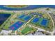Aerial view of the community tennis and basketball courts, plus a putting green at 16012 Sunny Day Dr, Bradenton, FL 34211