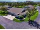 Aerial view of a residential neighborhood featuring well-manicured lawns and mature trees at 1612 Fairway Oaks Dr, Palmetto, FL 34221