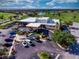 Aerial view of the community clubhouse featuring beautifully landscaped grounds and convenient parking at 1612 Fairway Oaks Dr, Palmetto, FL 34221