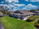 Charming home with well-maintained lawn, patio, and lush landscaping at 1612 Fairway Oaks Dr, Palmetto, FL 34221