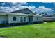 Well-manicured front yard featuring healthy green grass and neatly trimmed perimeter shrubs at 1612 Fairway Oaks Dr, Palmetto, FL 34221